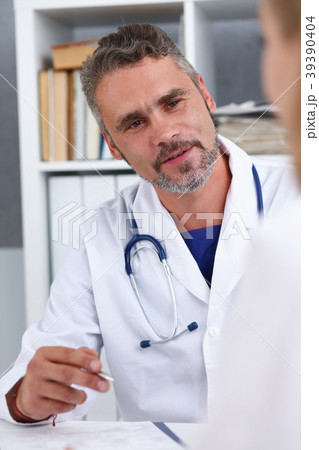 Smiling handsome mature doctor communicate 39390404