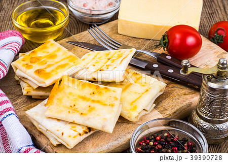Envelopes of thin Armenian bread lavash fried with Envelopes of thin Armenian bread lavash fried with 39390728