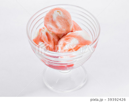 Vanilla ice cream with strawberry syrup on white Vanilla ice cream with strawberry syrup on white 39392426