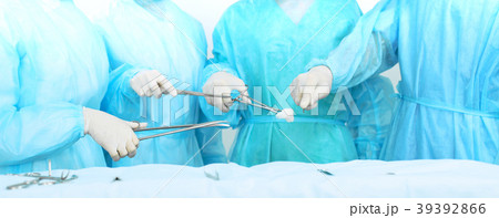 Close up of medical team in masks performing Close up of medical team in masks performing 39392866