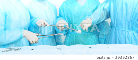 Close up of medical team in masks performing 39392867