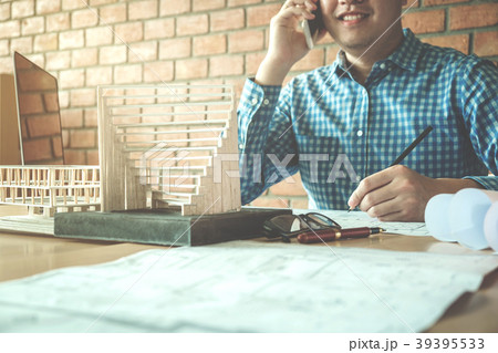 Architect or engineer using smart phone working 39395533