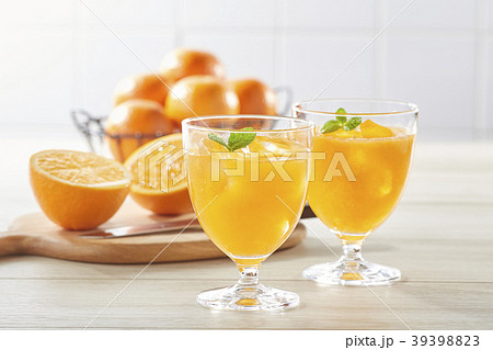 Juice In Glass Jar And Orange On Kitchen Table. Stock Photo, Picture and  Royalty Free Image. Image 14167034.