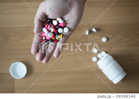 pills and medicines in the hand pharmaceutical pills and medicines in the hand pharmaceutical 39399140