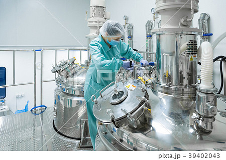 Pharmaceutical factory woman worker in protective Pharmaceutical factory woman worker in protective 39402043