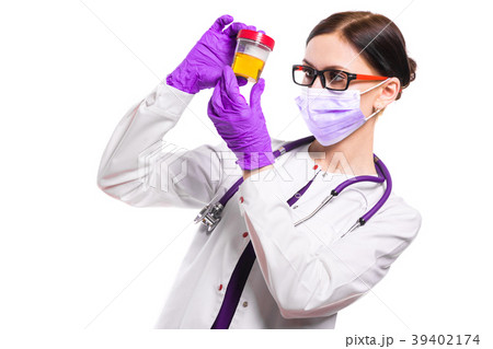 Young beautiful female doctor holding urine sample 39402174