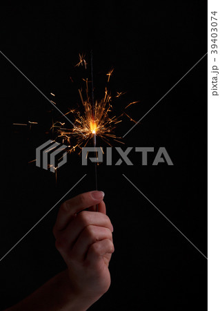 Female hands holding bengal light. Female hands holding bengal light. 39403074