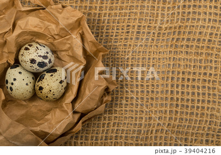 Quail Eggs on Burlap Background 39404216