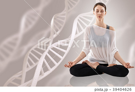 Young woman practicing yoga near big molecule Young woman practicing yoga near big molecule 39404626