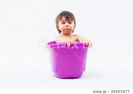 Adorable caucasian girl taking bath in purple tub 39405077