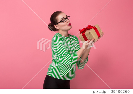 Businesswoman with hair bun and present 39406260