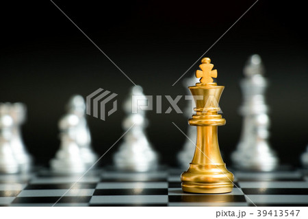 Gold king in chess game face with another silver 39413547
