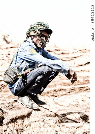 a black soldier and his gun looking the boarder a black soldier and his gun looking the boarder 39415118