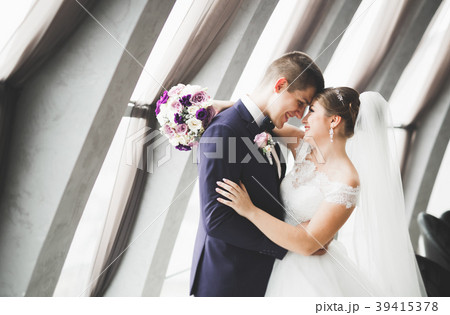 Gorgeous wedding couple posing in the old city 39415378