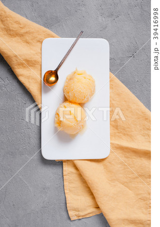 Two balls of  lemon sorbet in the white plate 39416998