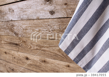 Striped napkin on the wooden background Striped napkin on the wooden background 39417055