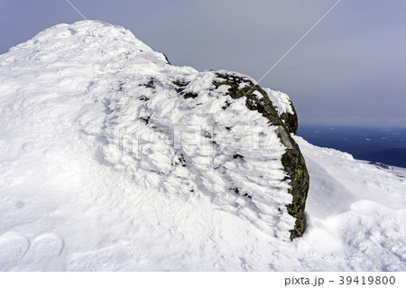 granite stone, covered with bizarre ice outgrowths granite stone, covered with bizarre ice outgrowths 39419800