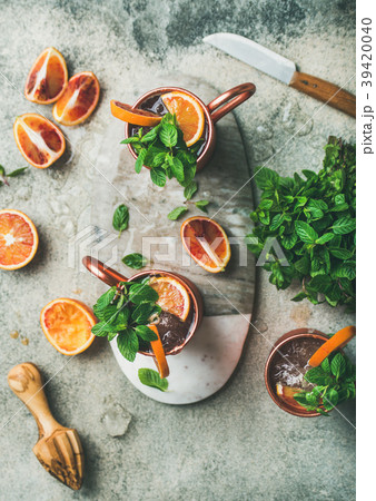 Blood orange Moscow mule alcohol cocktails in mugs 39420040