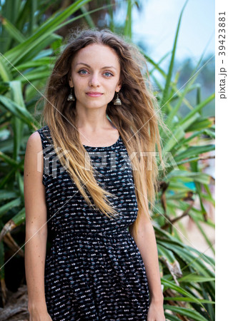 woman near tropical plants woman near tropical plants 39423881