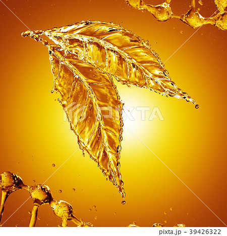 Leaf made of oil splash on gold background Leaf made of oil splash on gold background 39426322