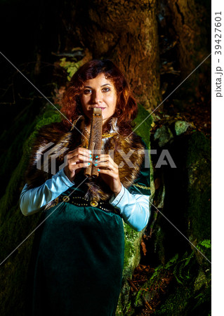 girl in historic dress with wooden flute in girl in historic dress with wooden flute in 39427601