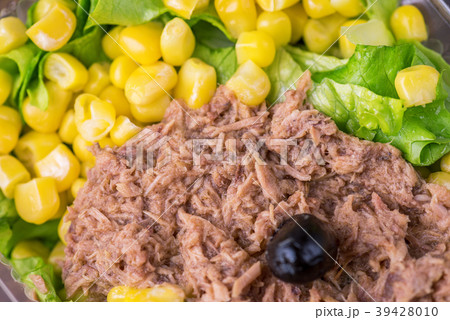 Tuna salad and Corn salad on wooden table. 39428010