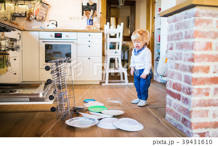 Toddler boy in dangerous situation at home. Child 39431610