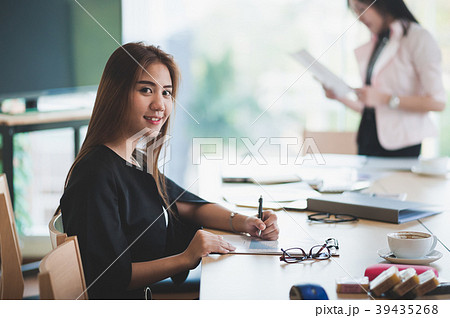 Asian executive female managing papework 39435268