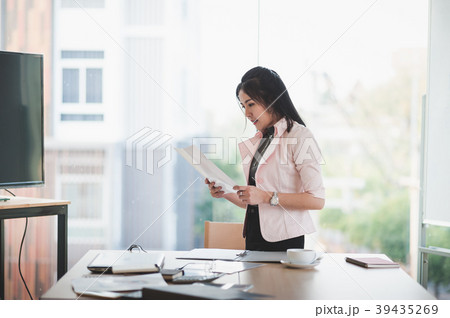 Asian executive female managing papework 39435269
