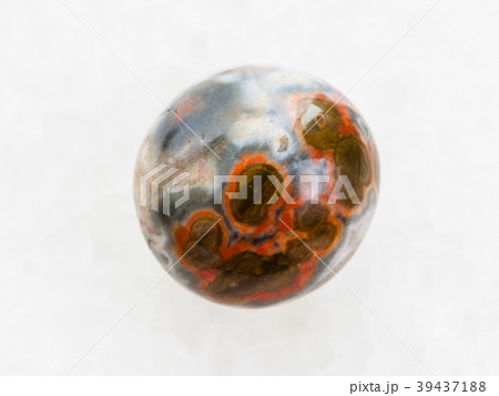 polished orbicular jasper gemstone on white marble polished orbicular jasper gemstone on white marble 39437188