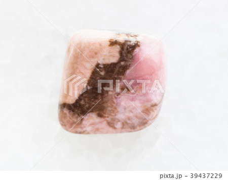 tumbled Rhodochrosite gemstone on white marble 39437229