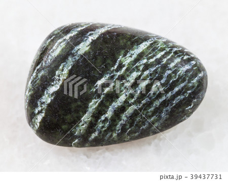 tumbled Chrysotile asbestos gemstone on white tumbled Chrysotile asbestos gemstone on white 39437731