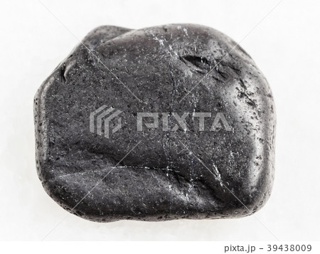 tumbled shungite gemstone on white marble 39438009