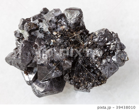 rough crystalline Magnetite stone on white marble 39438010