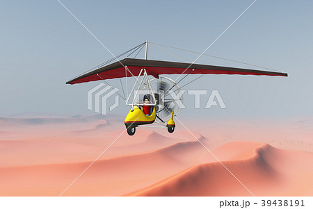 Ultralight trike over a sand desert 39438191