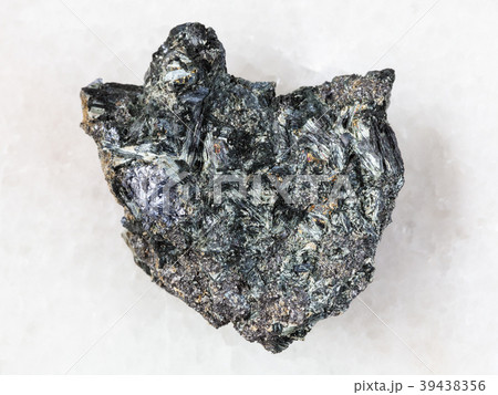 Molybdenite crystal in raw Glaucophane on white Molybdenite crystal in raw Glaucophane on white 39438356