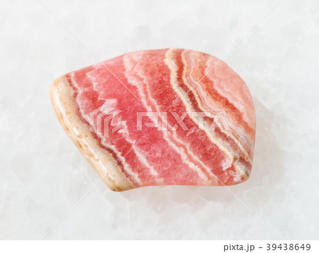 tumbled rhodochrosite gem stone on white 39438649