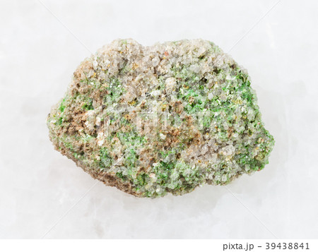 green Pintadoite crystals in rough stone on white green Pintadoite crystals in rough stone on white 39438841