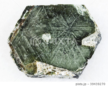 Phlogopite mica stone on white marble 39439270