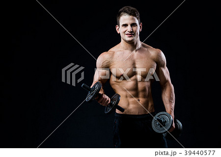 Handsome power athletic man training pumping up 39440577