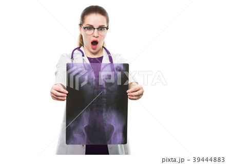 Attractive young woman doctor holding x-ray making 39444883