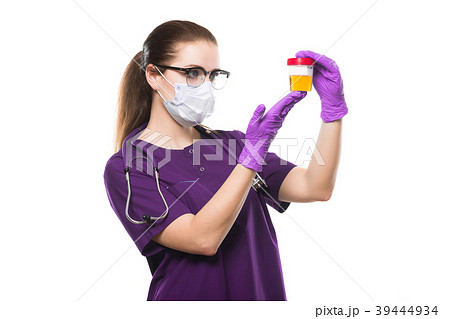 Attractive caucasian female doctor holding urine Attractive caucasian female doctor holding urine 39444934