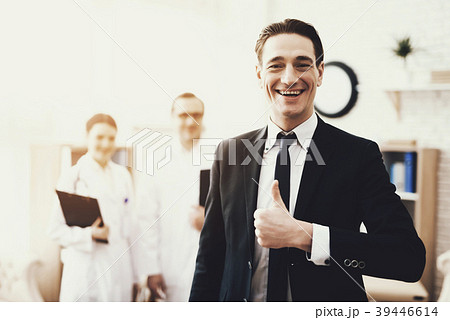 Businessman shows thumbs up while in clinic Businessman shows thumbs up while in clinic 39446614