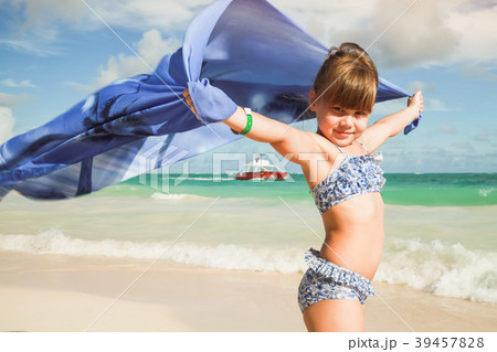 Little blond Caucasian girl with blue shawl 39457828