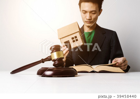 Real estate insurance lawyer working hard. Real estate insurance lawyer working hard. 39458440