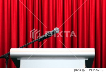 microphone on stage with red curtain background 39458785