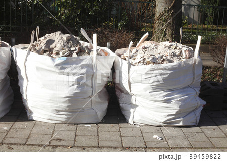 white garbage bags with rubble stones 39459822