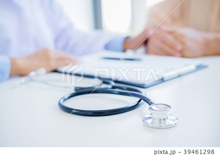 Patient listening intently to a male doctor Patient listening intently to a male doctor 39461298