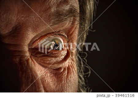 Half face of aggressive man looking with hatred Half face of aggressive man looking with hatred 39461516