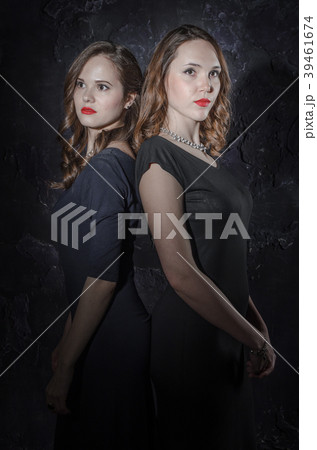 Two handsome girl friends standing together back 39461674